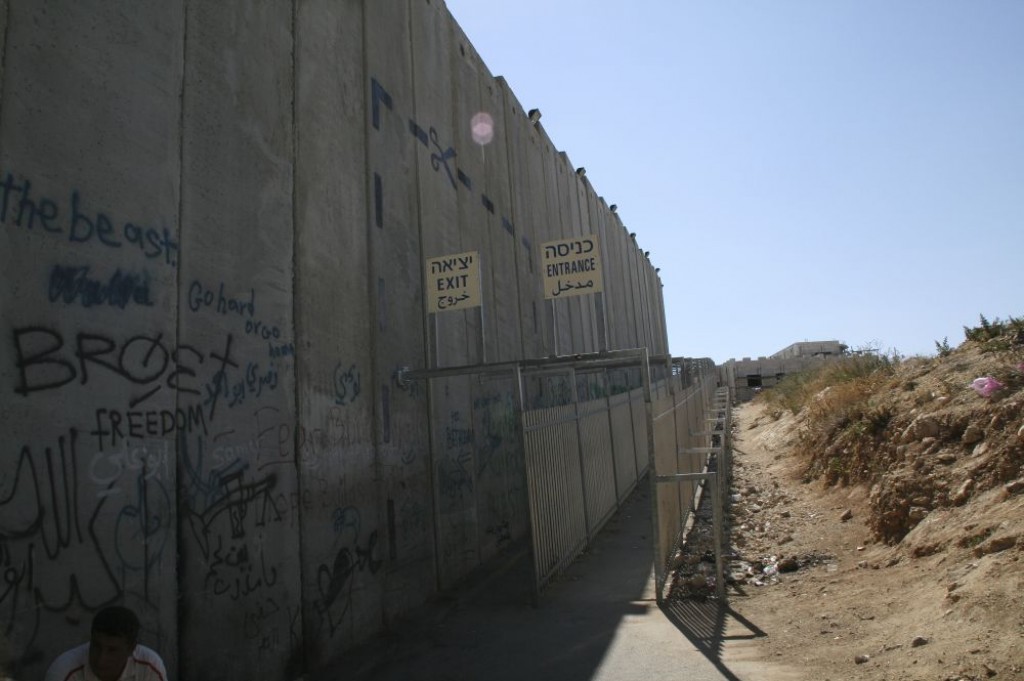 We took a bus out to Bethlehem from Jerusalem. It stopped at the checkpoint at the West Bank. This is the wall that separates the West Bank from Israel.
